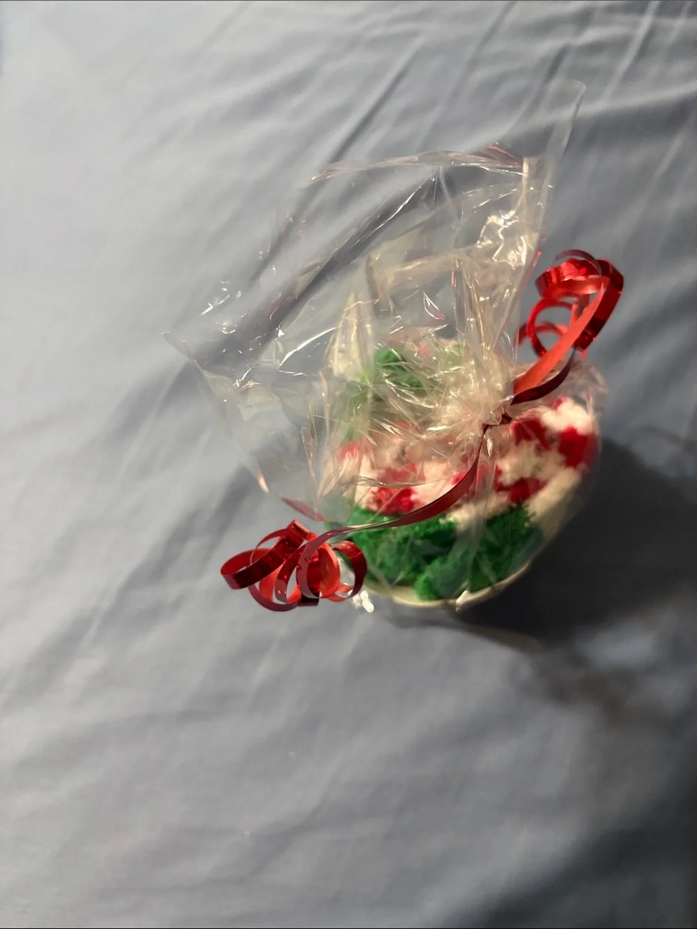 Holiday Santa Cupcake sock Gift - Red, Green, White wrapped and tied with ribbon